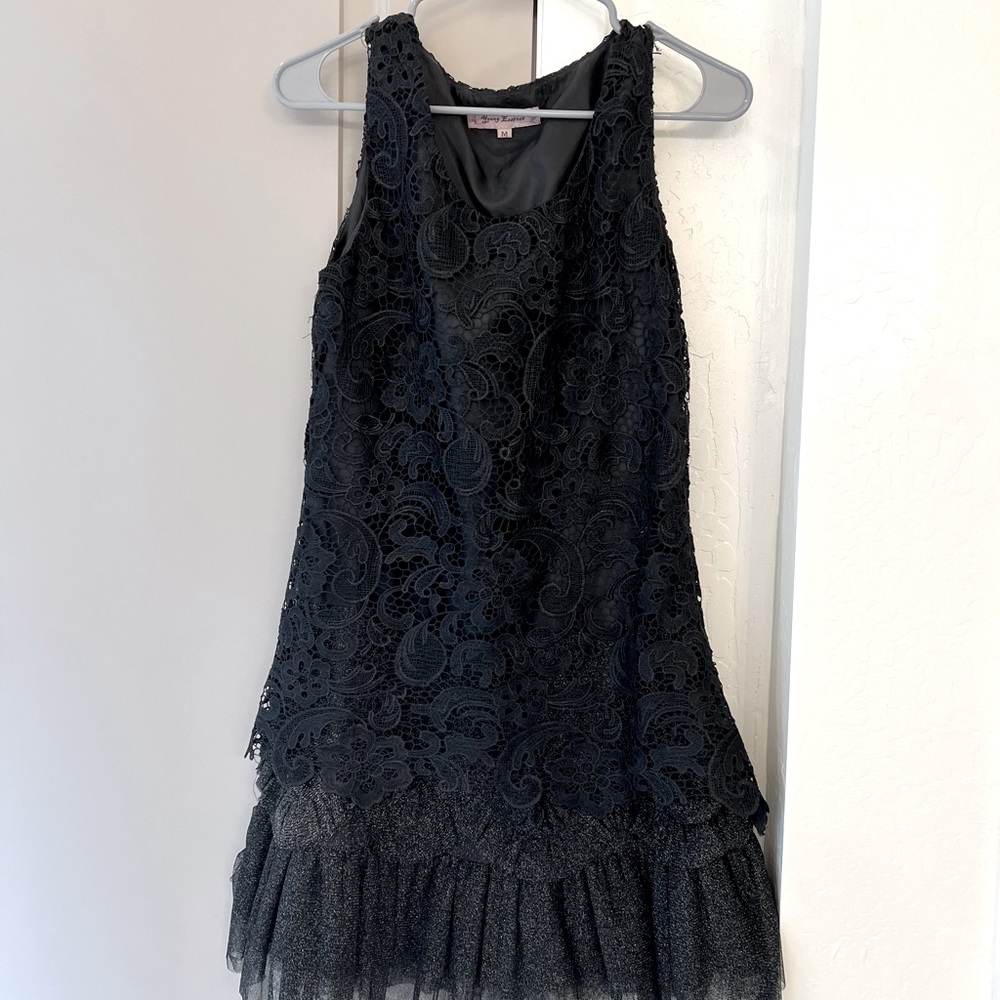 Medium black layered lace dress. Sleeveless.